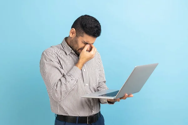 Portrait Young Adult Businessman Standing Laptop Hands Rubbing His Eyes — Fotografia de Stock