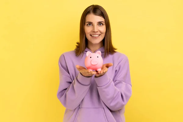 Attractive Smiling Young Adult Woman Pleasant Appearance Showing Piggy Bank — Stock Fotó