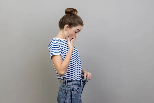 Portrait Beautiful Surprised Woman Wearing Striped Shirt Looking Her Slim — Stock Fotó