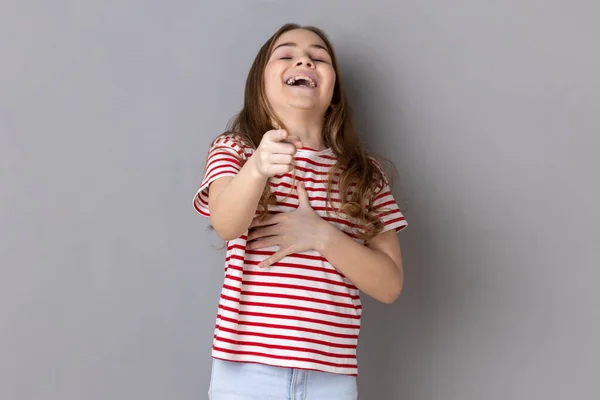 Portrait Little Girl Wearing Striped Shirt Laughing Holding Stomach Pointing — Zdjęcie stockowe