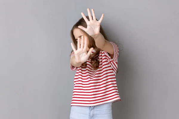 Portrait Scared Little Dark Haired Girl Wearing Striped Shirt Gesturing — Stock Fotó