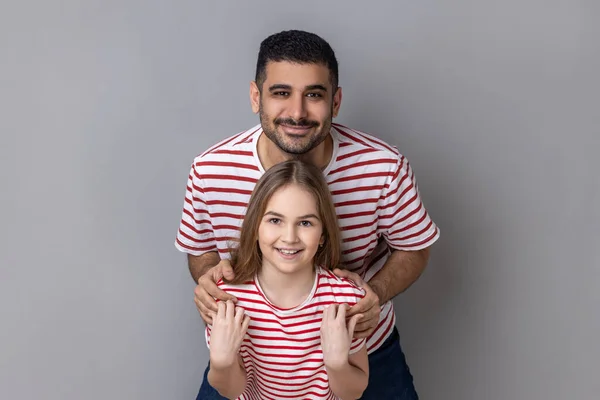 Portrait Delighted Smiling Father Daughter Striped Shirts Standing Looking Camera —  Fotos de Stock