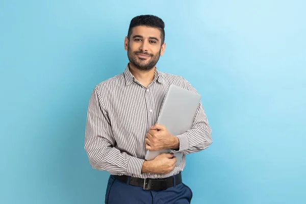 Portrait Smiling Businessman Standing Holding Closed Laptop Folder Looking Camera — Stockfoto