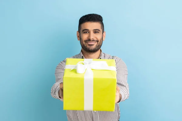 Portrait Smiling Bearded Businessman Giving Wrapped Yellow Gift Box Smiling — Stock Fotó