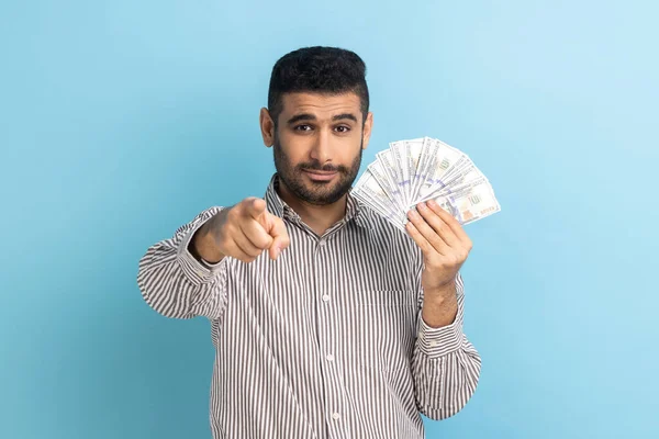 Portrait Young Businessman Pointing Camera Holding Dollar Banknotes Encouraging Win — Stok fotoğraf