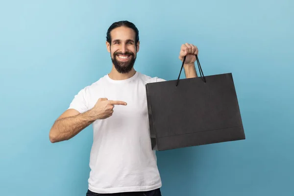 Portrait Optimistic Man Beard Wearing White Shirt Pointing Shopping Bags — ストック写真