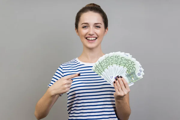 Portrait Woman Wearing Striped Shirt Pointing Finger Fan Euros Her — 스톡 사진