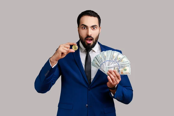 Shocked Man Showing Dollar Bills Golden Coin Crypto Currency Transferring — Stok fotoğraf