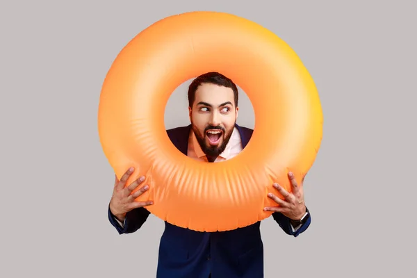 Bearded Man Holding Rubber Ring Her Neck Looking Away Surprised — Stock Fotó