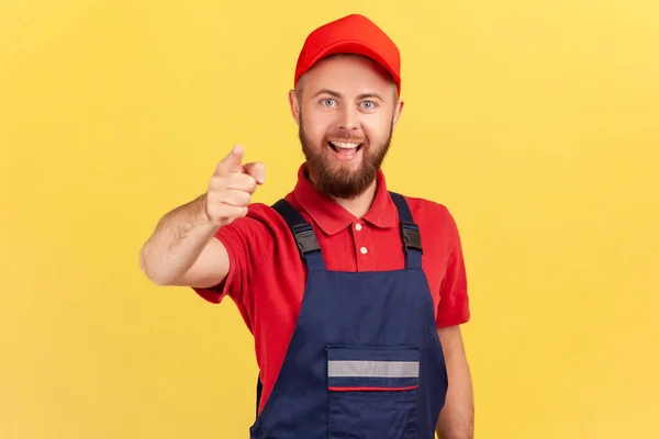 Portrait Smiling Bearded Satisfied Man Worker Standing Pointing Finger Camera — Stock Photo, Image