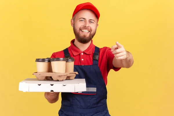 Portrait Joyful Deliveryman Standing Pizza Box Coffee Disposable Cup Pointing — Stok Foto