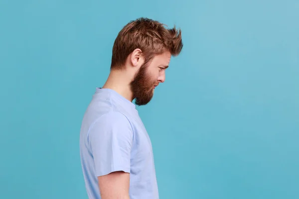 Side View Bearded Upset Young Man Standing Looking Camera Dissatisfied — Stockfoto