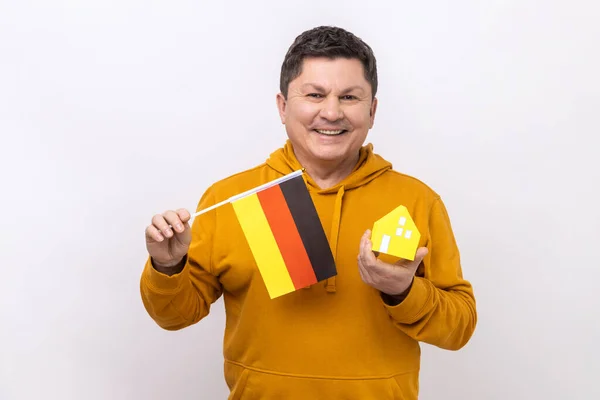 Optimistic Man Holding German Flag Paper House Dreaming Buy His — Foto de Stock