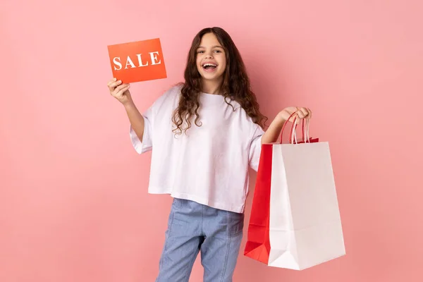 Portrait Excited Little Girl Wearing White Shirt Smiling Boasting Purchases — Stok fotoğraf