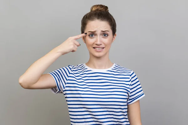 Crazy Idea Portrait Woman Wearing Striped Shirt Showing Stupid Gesture — стоковое фото