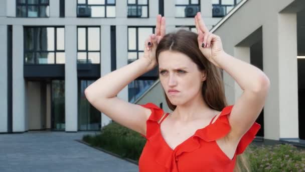 Aggressive Bully Woman Long Hair Wearing Red Elegant Dress Holding — Stock Video