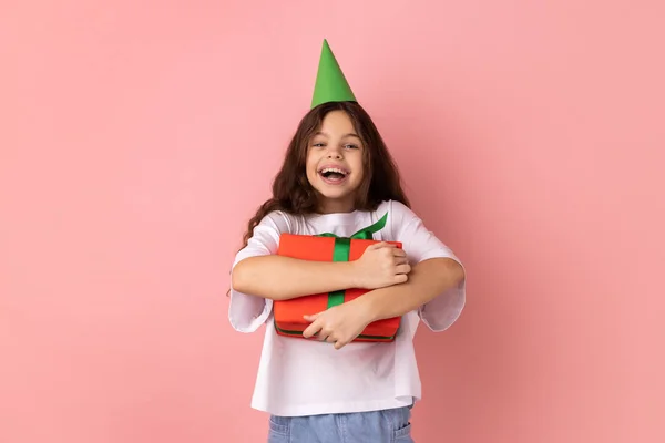 Portrait Excited Little Girl Wearing White Shirt Party Cone Embracing — Stock Photo, Image