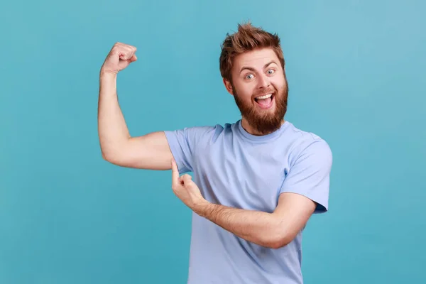 Portrait Excited Bearded Man Pointing Finger His Arm Muscle Pumping — Stock Photo, Image