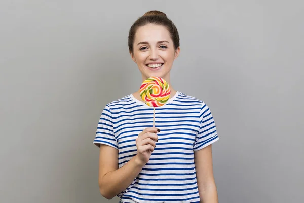 Portrait Smiling Woman Wearing Striped Shirt Holding Striped Colorful Lollipop — Stock Photo, Image