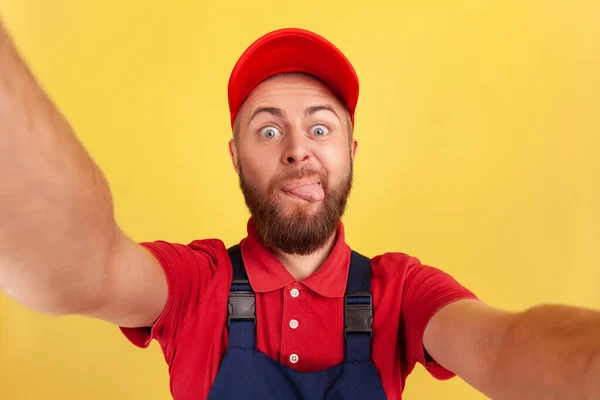 Childish Worker Man Wearing Red Cap Blue Uniform Taking Selfie — Stock Photo, Image