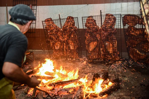 Gaucho roast barbecue, sausage and cow ribs, traditional argentine cuisine, Patagonia, Argentina.