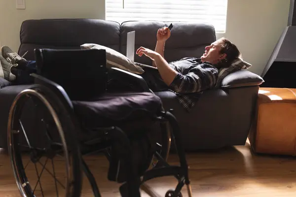 Caucasian Disabled Man Using Laptop While Lying Couch Home Disability — Stock Photo, Image