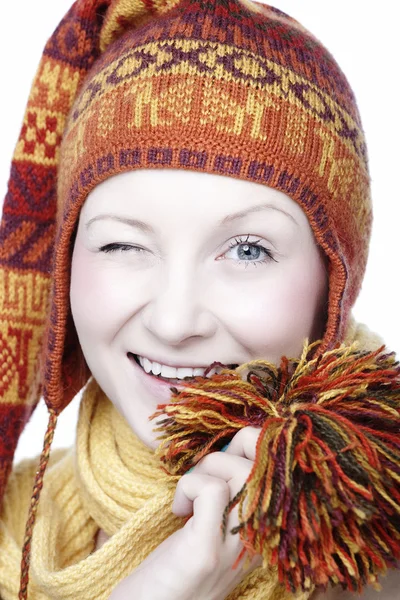 Winking woman in funny hat — Stock Photo, Image