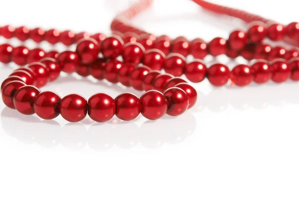 Red pearls on white — Stock Photo, Image