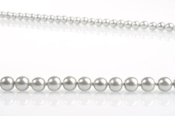 Pearls on white — Stock Photo, Image