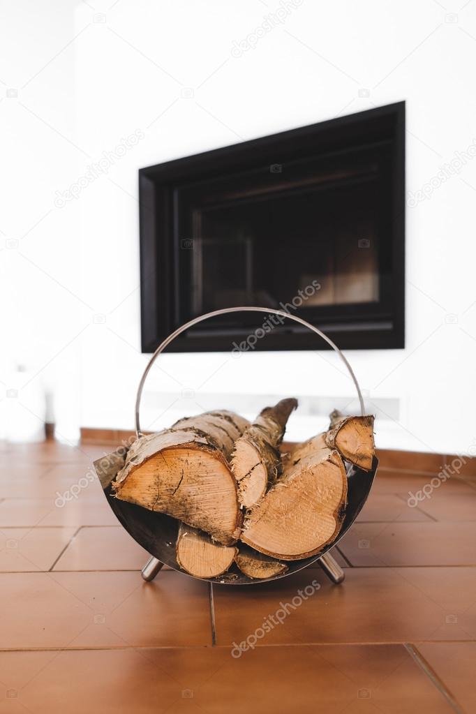 Modern Fireplace and Firewood Stacked on the Stand