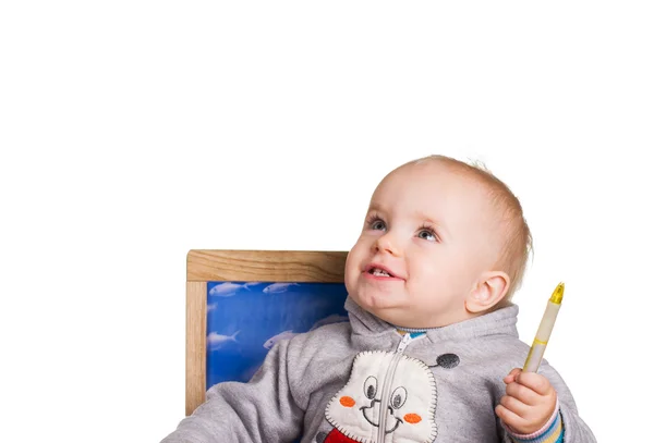 Niño con una pluma mira hacia arriba — Foto de Stock