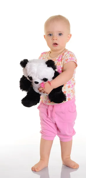 Baby holding plush toy over white background — Stock Photo, Image