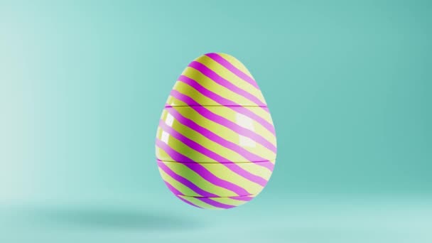Zapętlone wideo z jajkiem wielkanocnym z obracającymi się częściami. Animacja CGI, niebieskie, żółte i różowe pastelowe kolory — Wideo stockowe