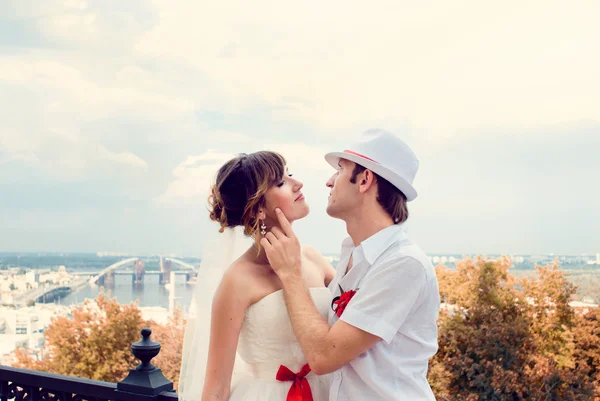 Fiancee and groom, sitting near a church — Stock Photo, Image