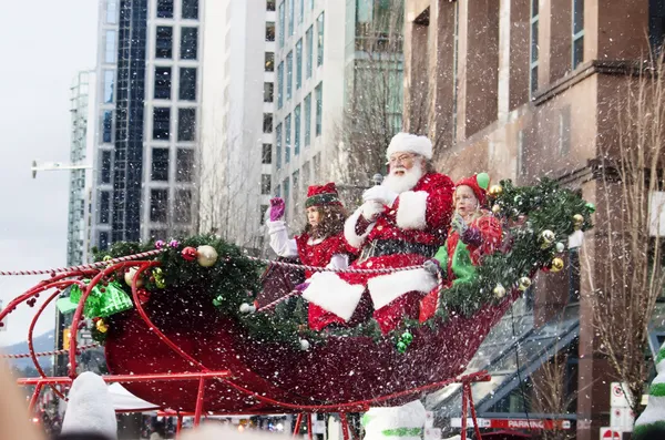 Santa claus tijdens Kerstmis parade downtown - geïsoleerd Stockfoto