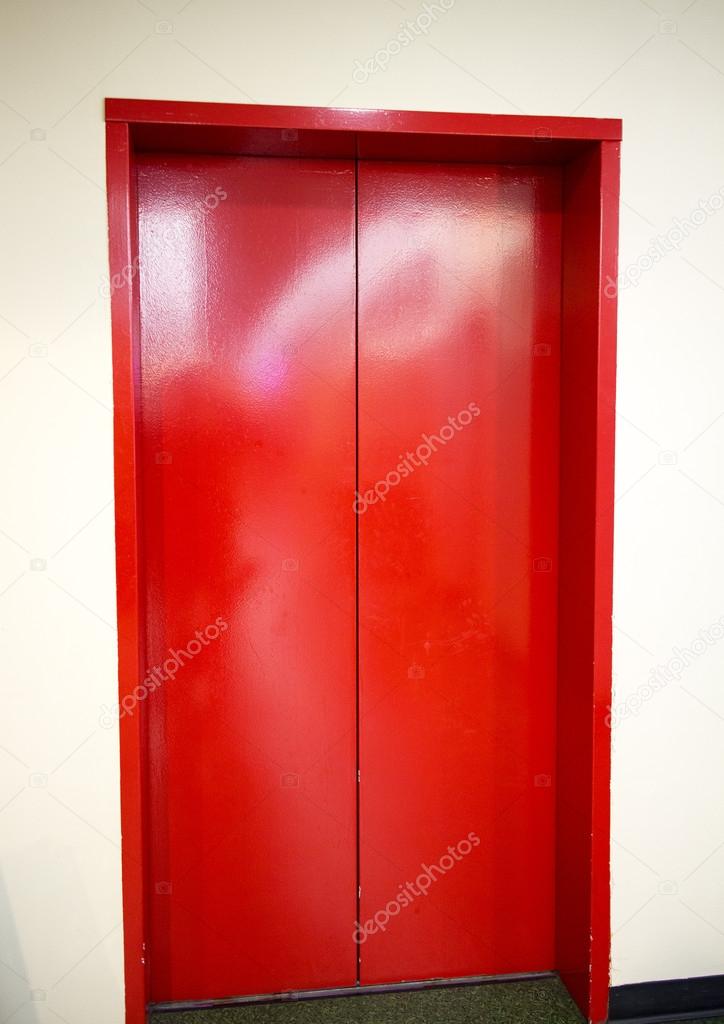 Freshly painted red elevator doors