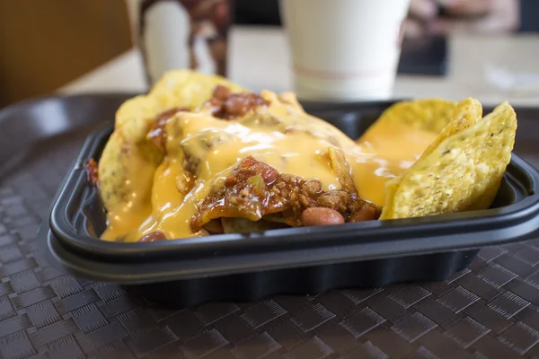 Nacho chips with chili and cheese — Stock Photo, Image