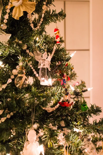 Christmas tree by door — Stock Photo, Image