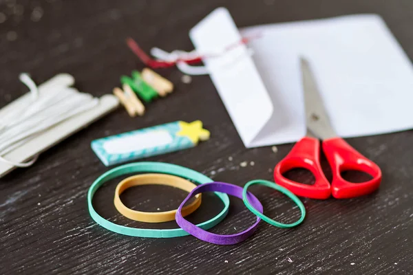 Elastic bands and homemade tools for crafting and homework
