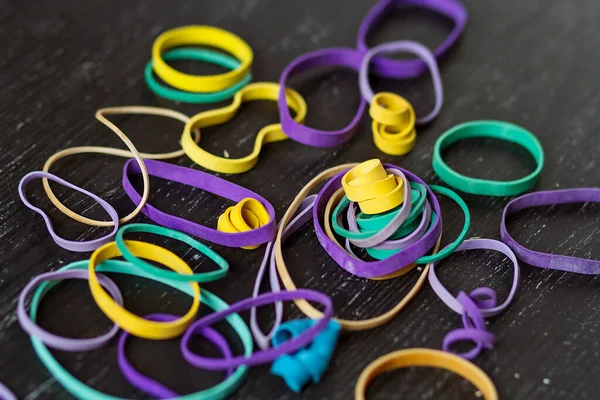 Elastic bands and homemade tools for crafting and homework