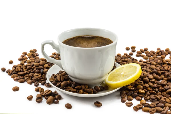 Cup of coffee with lemon and grains — Stock Photo, Image