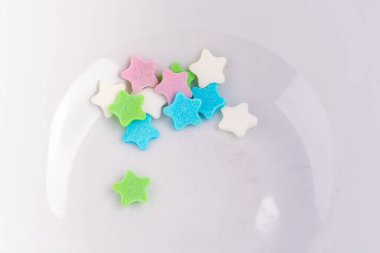 colorful sweet stars as cake decoration