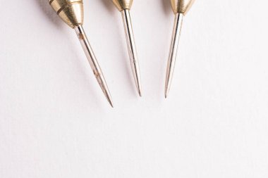 Three arrows dart tips on white with text space