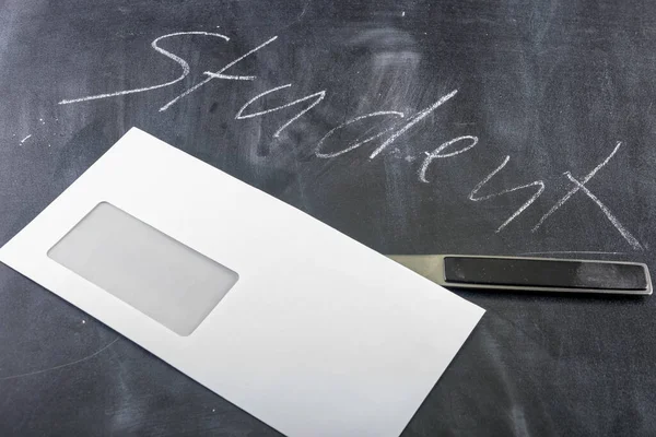 White envelope with letter opener and the word Student