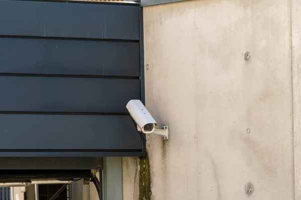 Surveillance camera at the house entrance on the wall