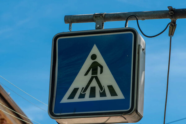 Traffic sign for pedestrian crossing in blue