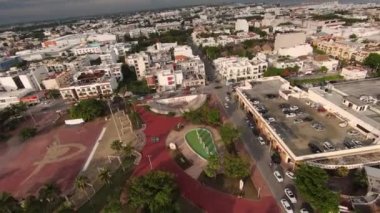 Panoramic aerial view over park Andador Solidaridad in Mexican resort of Playa del Carmen surrounded with white commercial tourist buildings.