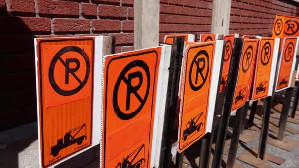 Camera Panning Slow Motion Group Orange Parking Signs Stored Red — Vídeo de Stock