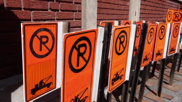 Camera Panning Slow Motion Group Orange Parking Signs Stored Red — ストック動画