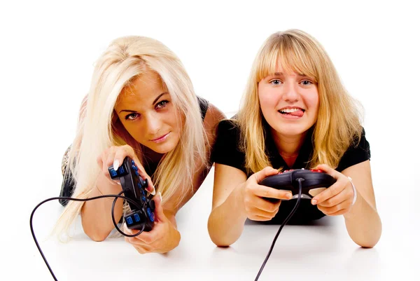 Two happy girls play video games — Stock Photo, Image